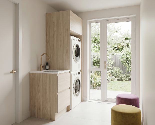 Studio Kit - compact laundry storage with washer/dryer space, drawers, sink and benchtop.